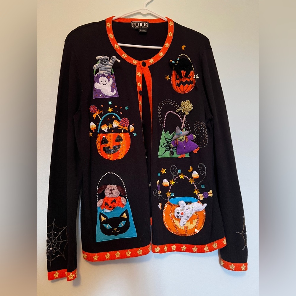 Halloween sweater with movable 3 dimensional spooky pieces.